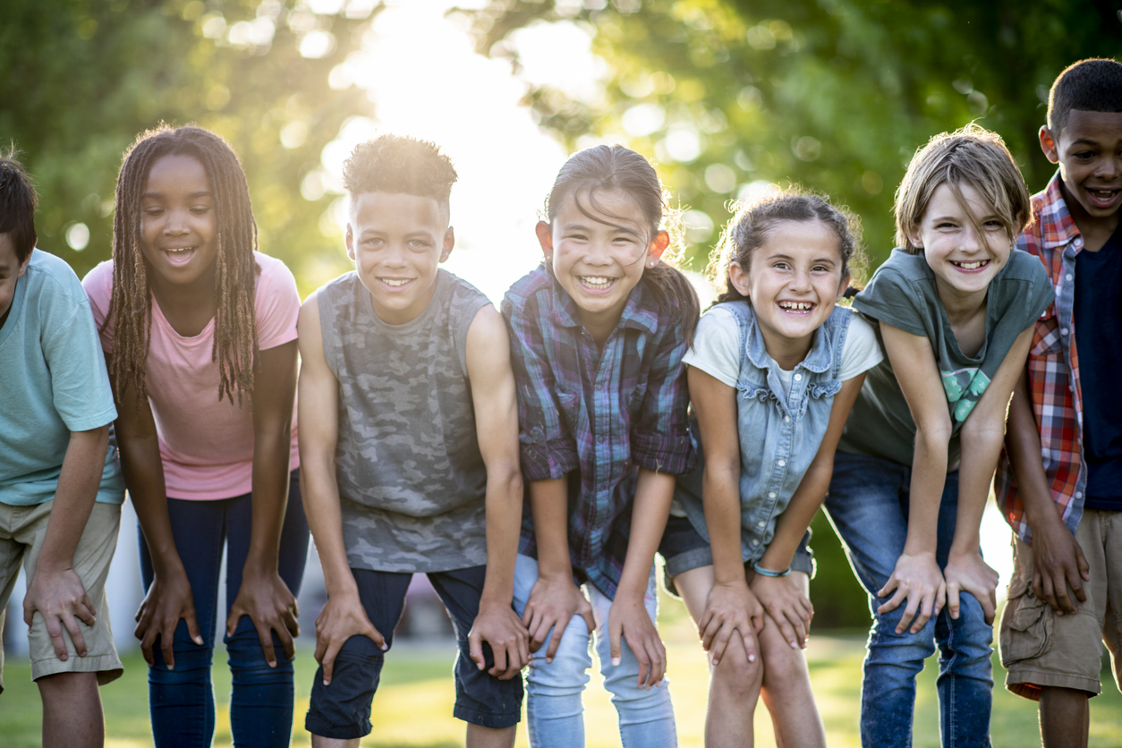 Group of children standing in a row outdoors